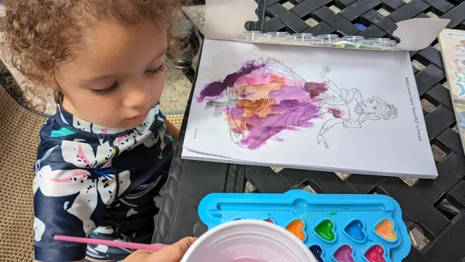 Nora painting with watercolor